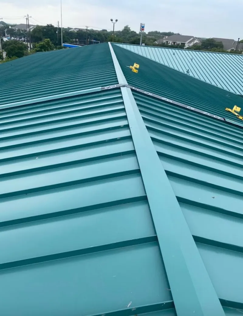 Green commercial metal roof ridge and valley for Metal Roof Repair in Cedar Rapids