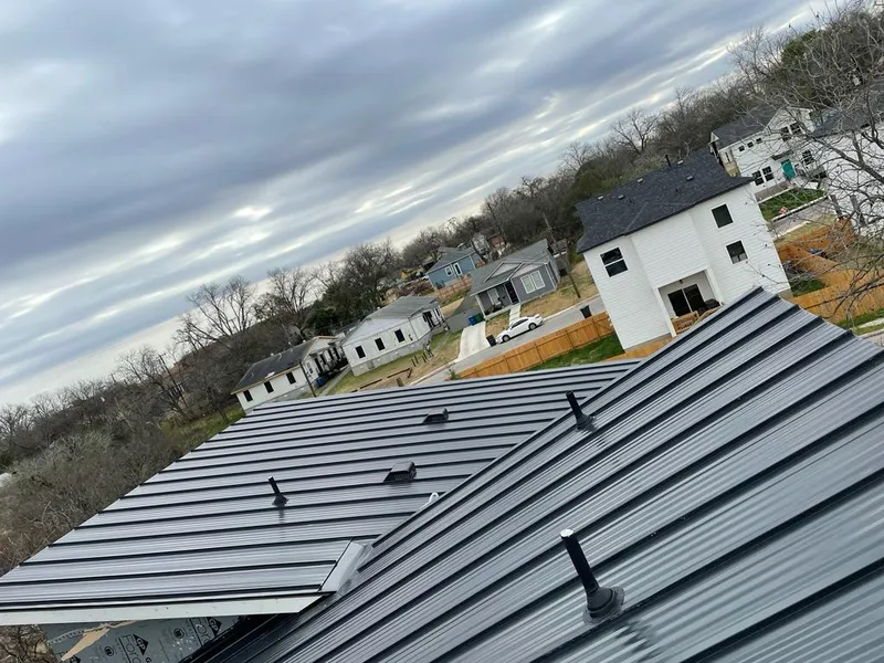 Standing seam metal roof panels with vents for Skylight Repair in Cedar Rapids